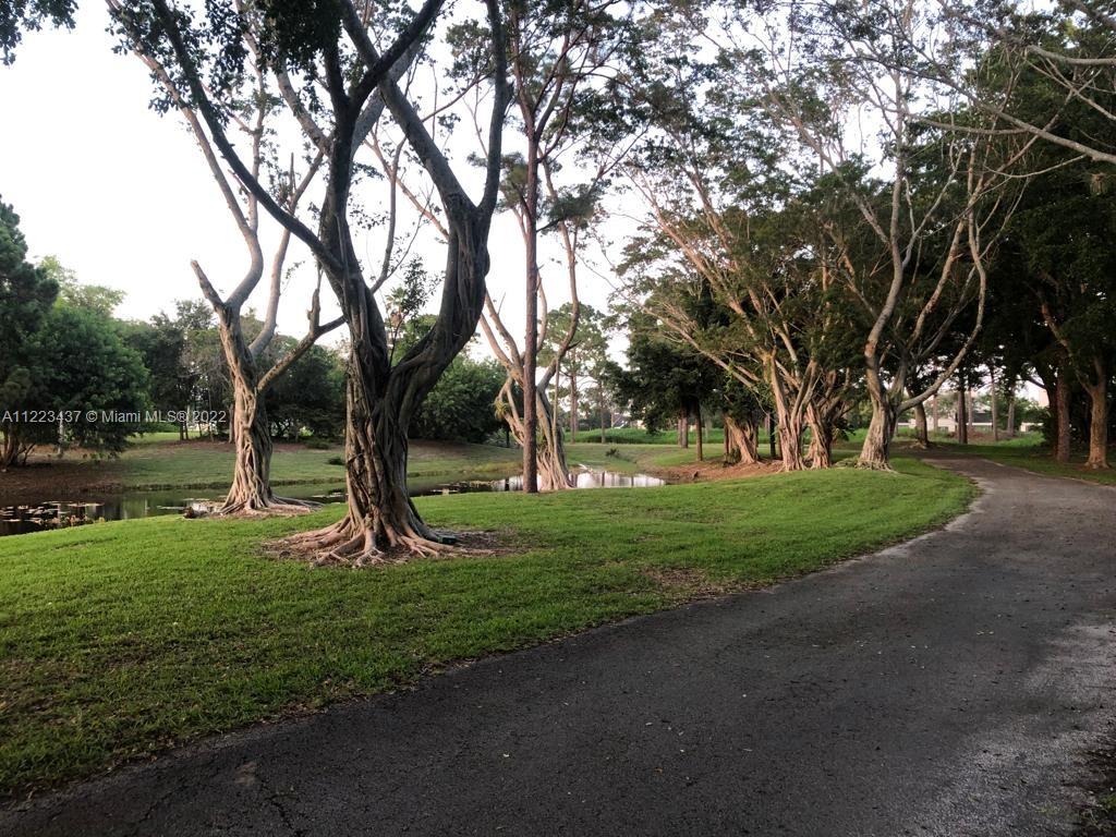 6017 Le Lac Road Boca Raton, FL 33496 - Photo 6 of 46 a view of a park with a tree