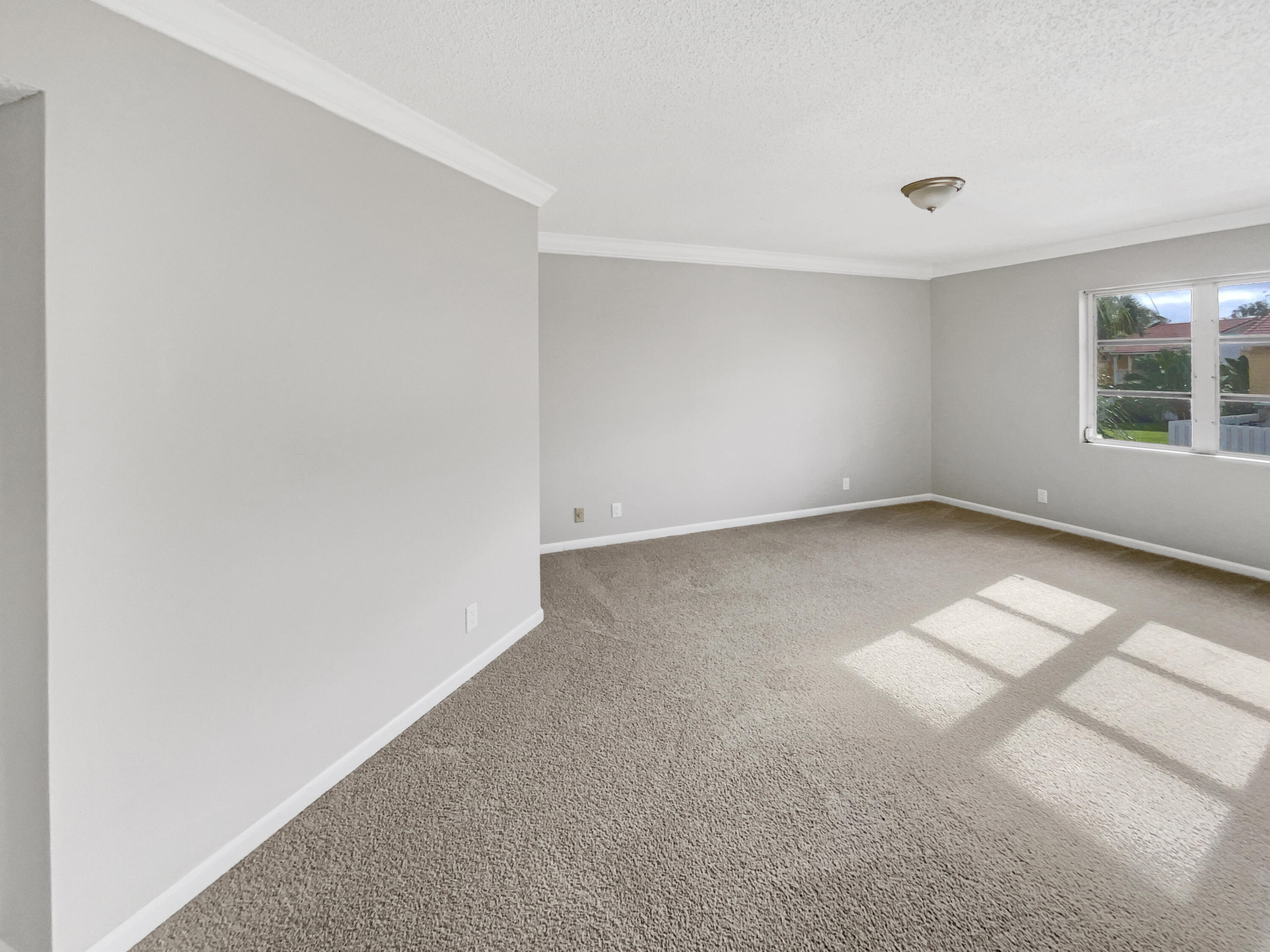 109 Seabreeze Circle Jupiter, FL 33477 - Photo 13 of 28 an empty room with windows and entrance