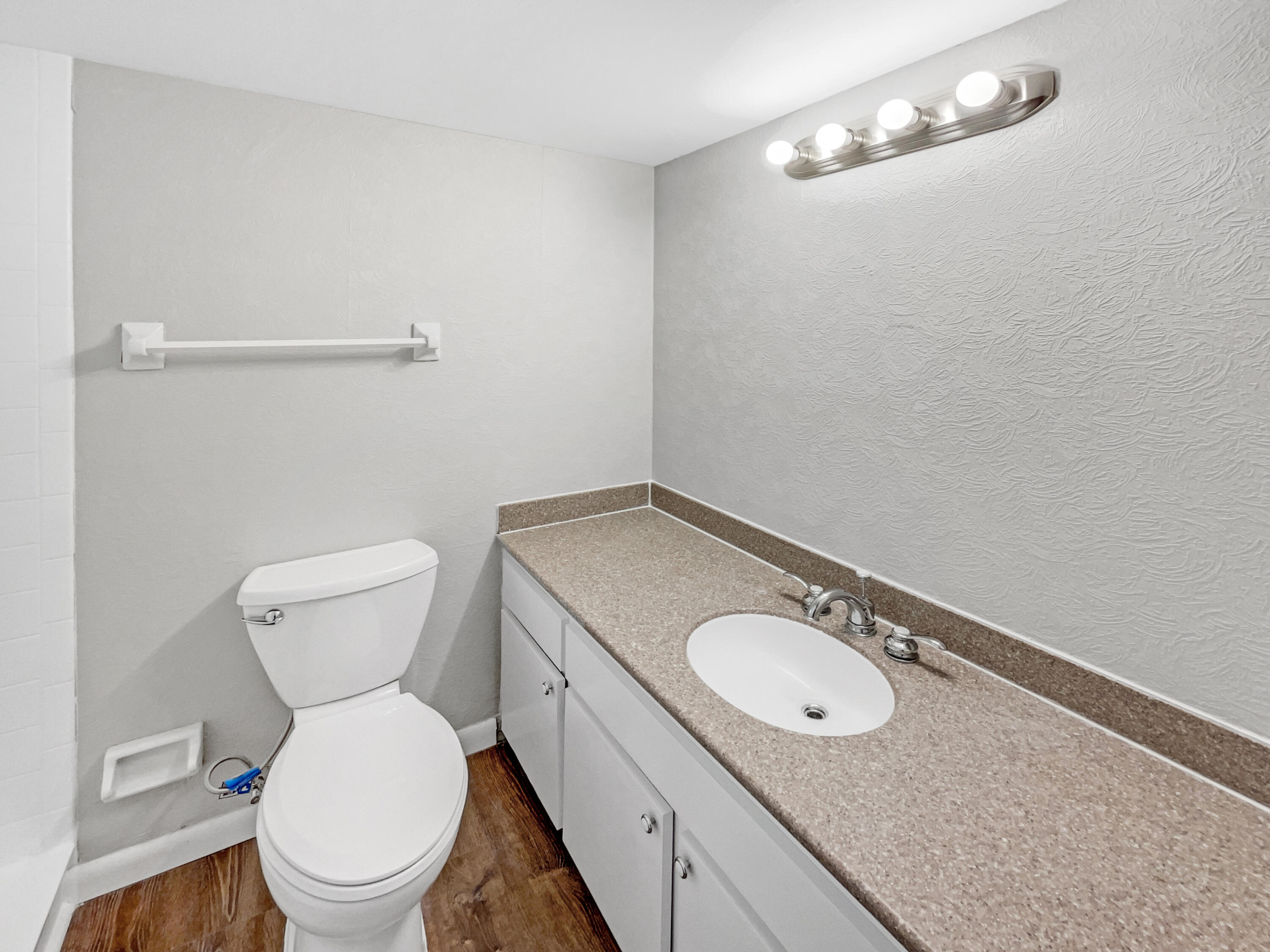 109 Seabreeze Circle Jupiter, FL 33477 - Photo 16 of 28 a bathroom with a granite countertop toilet and a sink