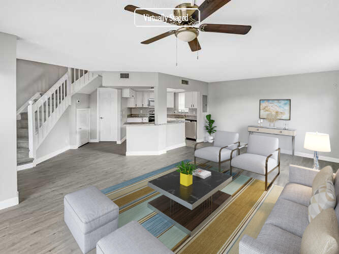 109 Seabreeze Circle Jupiter, FL 33477 - Photo 2 of 28 a living room with kitchen and furniture