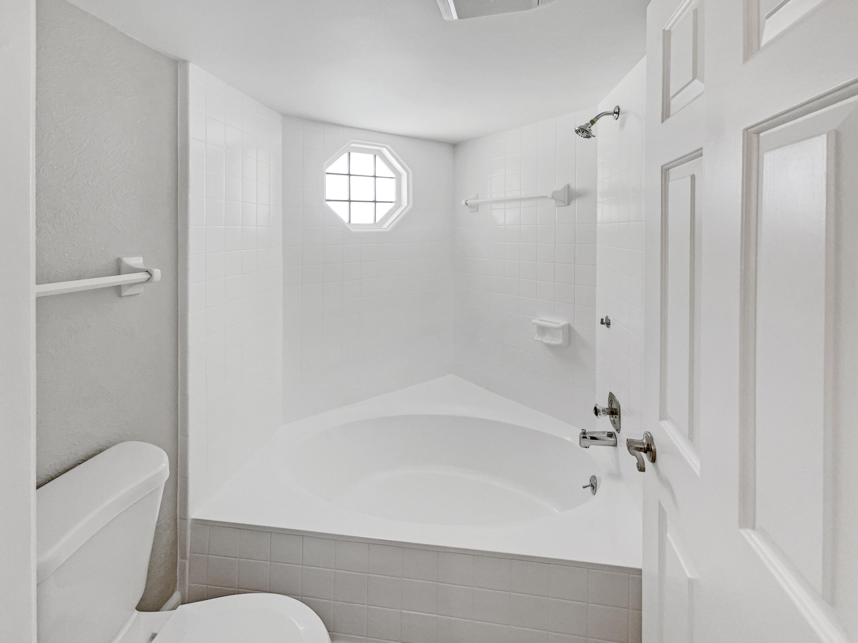 109 Seabreeze Circle Jupiter, FL 33477 - Photo 6 of 28 a bathroom with a bathtub and a shower