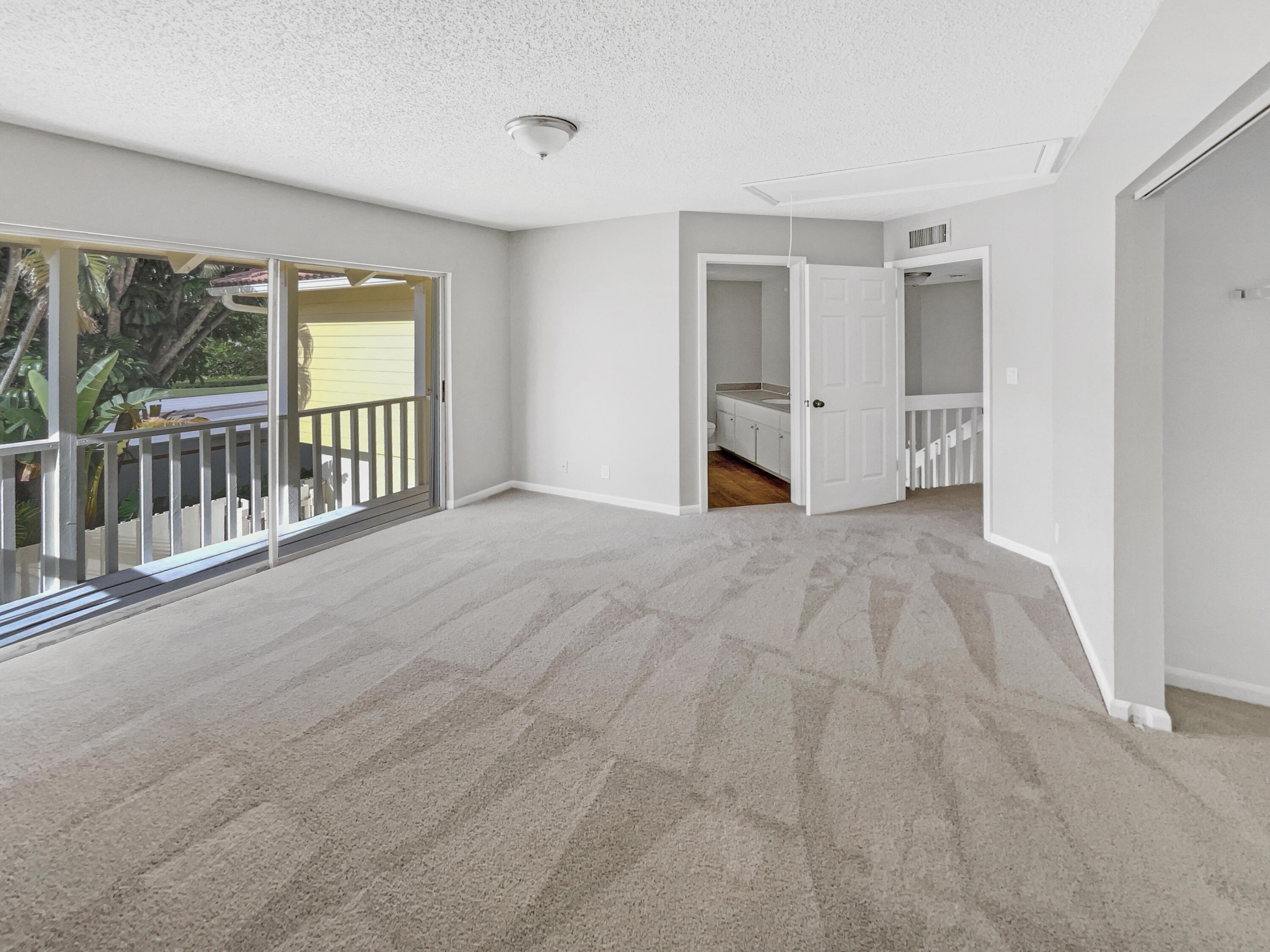 109 Seabreeze Circle Jupiter, FL 33477 - Photo 8 of 28 a view of an empty room with a window