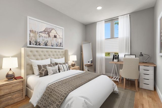 a bedroom with a bed and a table in it