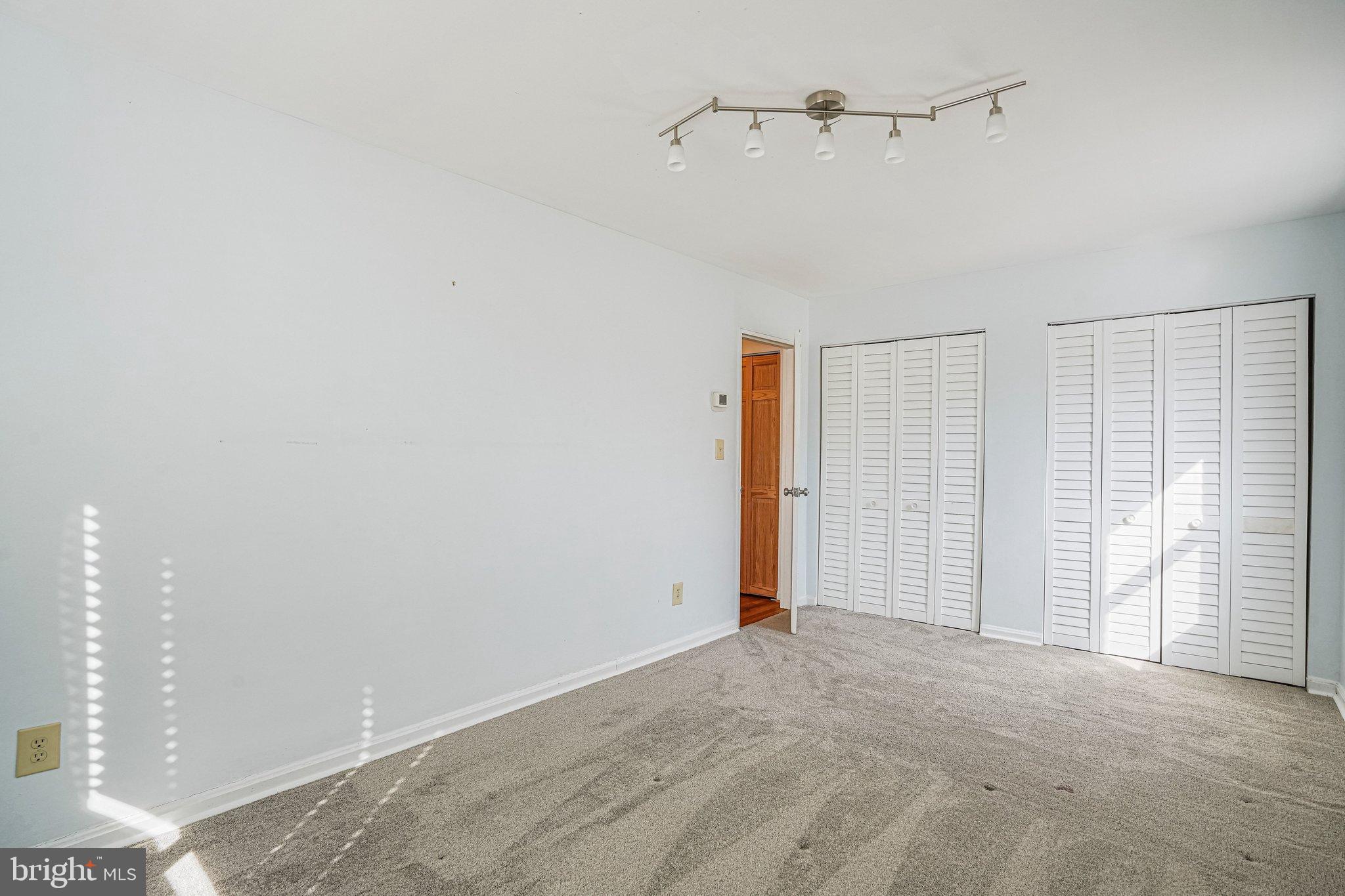 95 East Wayne Avenue, Unit 209 Silver Spring, MD 20901 - Photo 12 of 19 Bright second bedroom with large closets