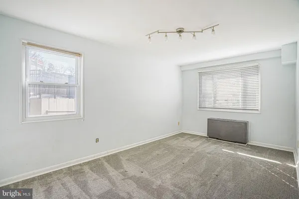 a view of an empty room with a window