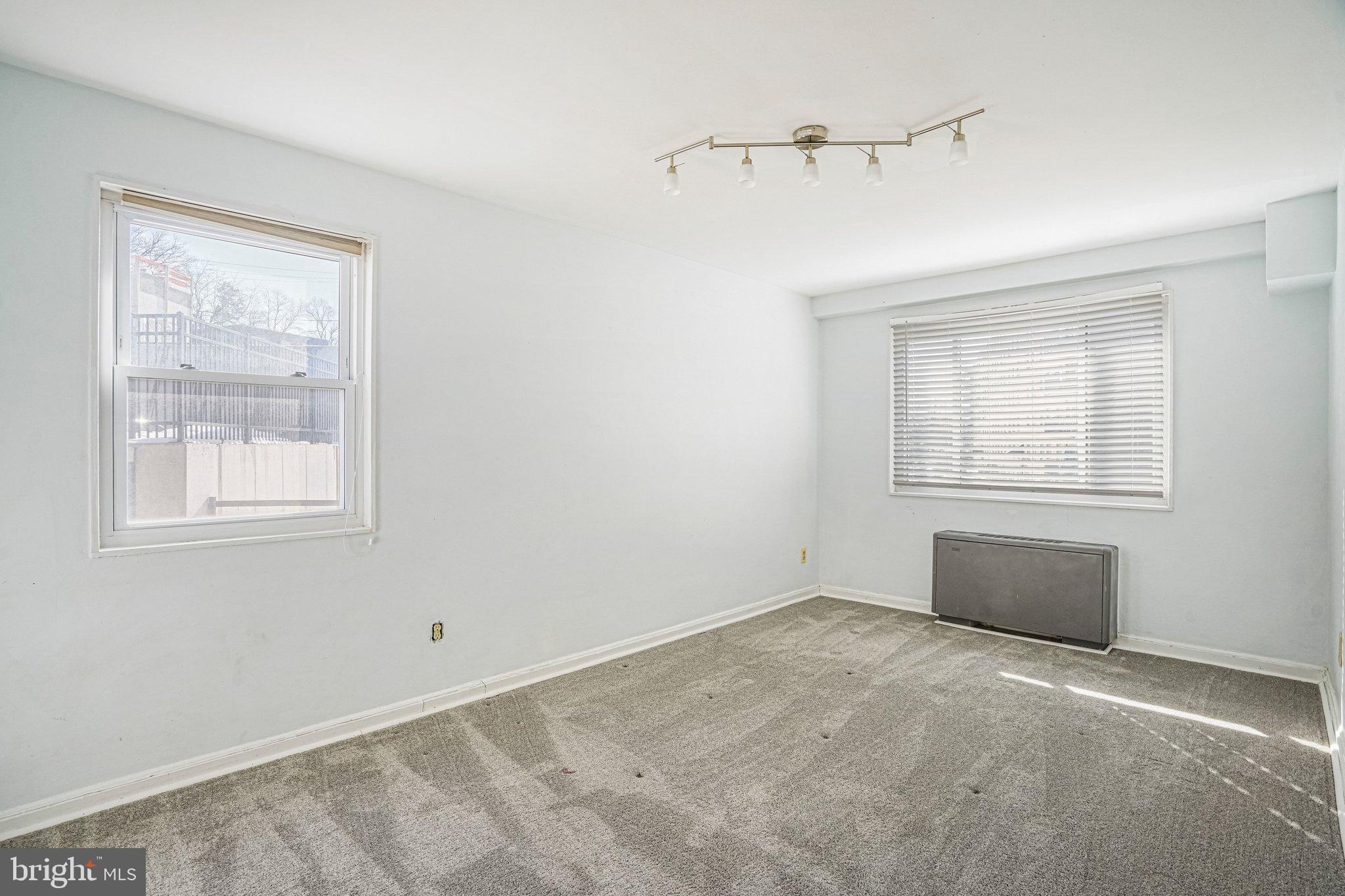95 East Wayne Avenue, Unit 209 Silver Spring, MD 20901 - Photo 13 of 19 Bright second bedroom with large closets