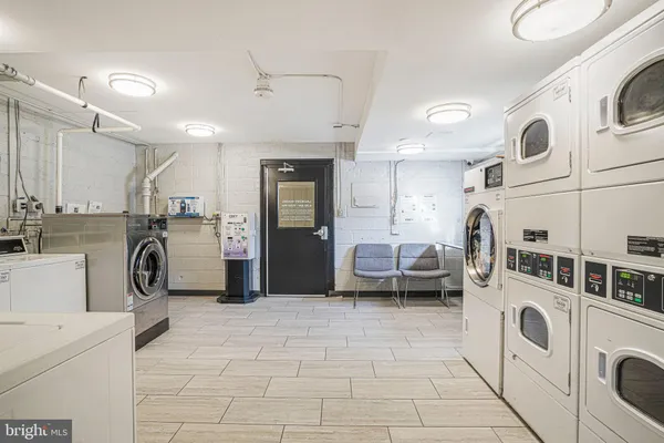 a kitchen with a sink a stove and cabinets