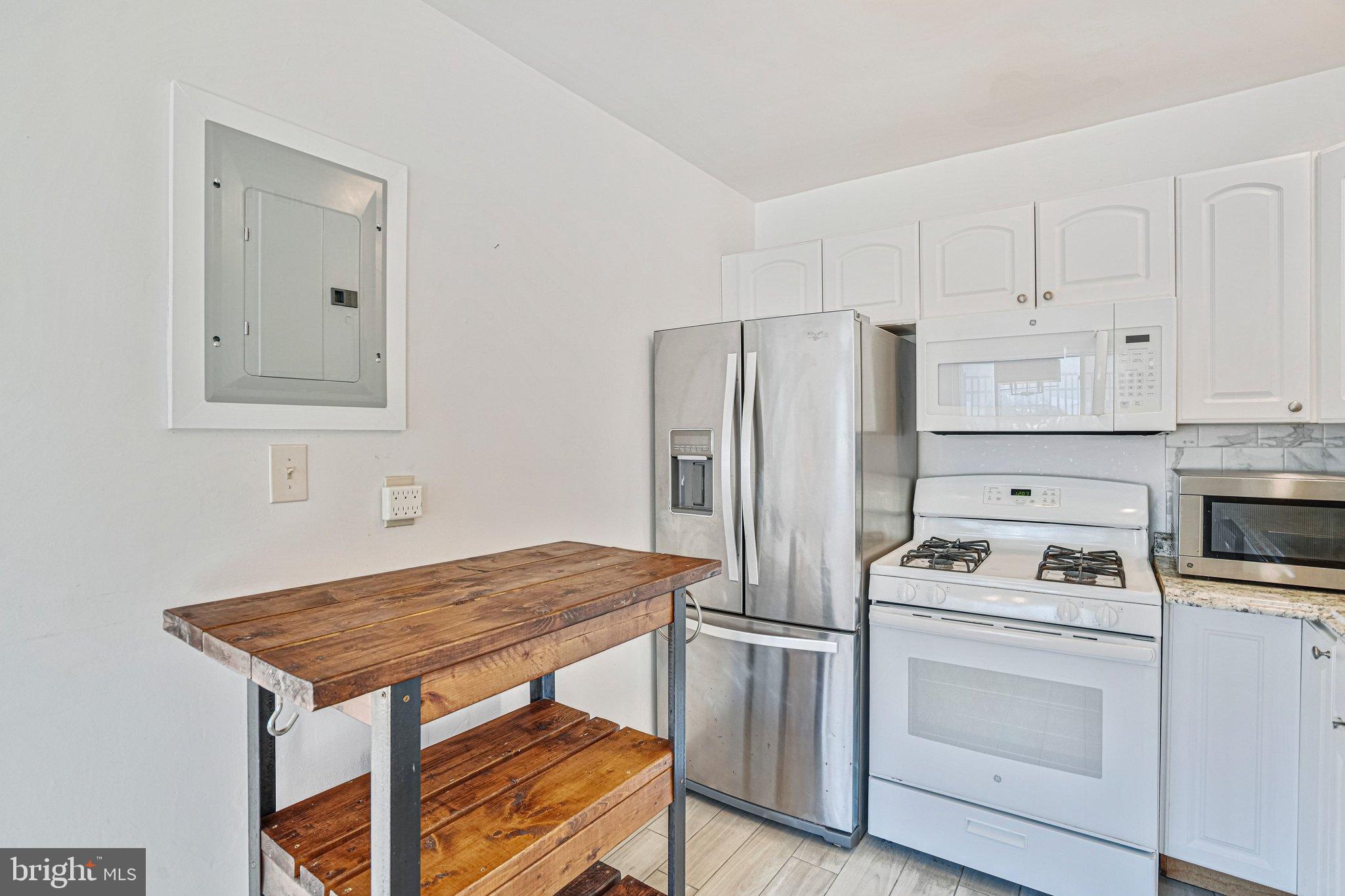 95 East Wayne Avenue, Unit 209 Silver Spring, MD 20901 - Photo 6 of 19 Open kitchen with updated appliances.