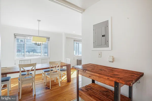 a view of a dining room with furniture window and wooden floor