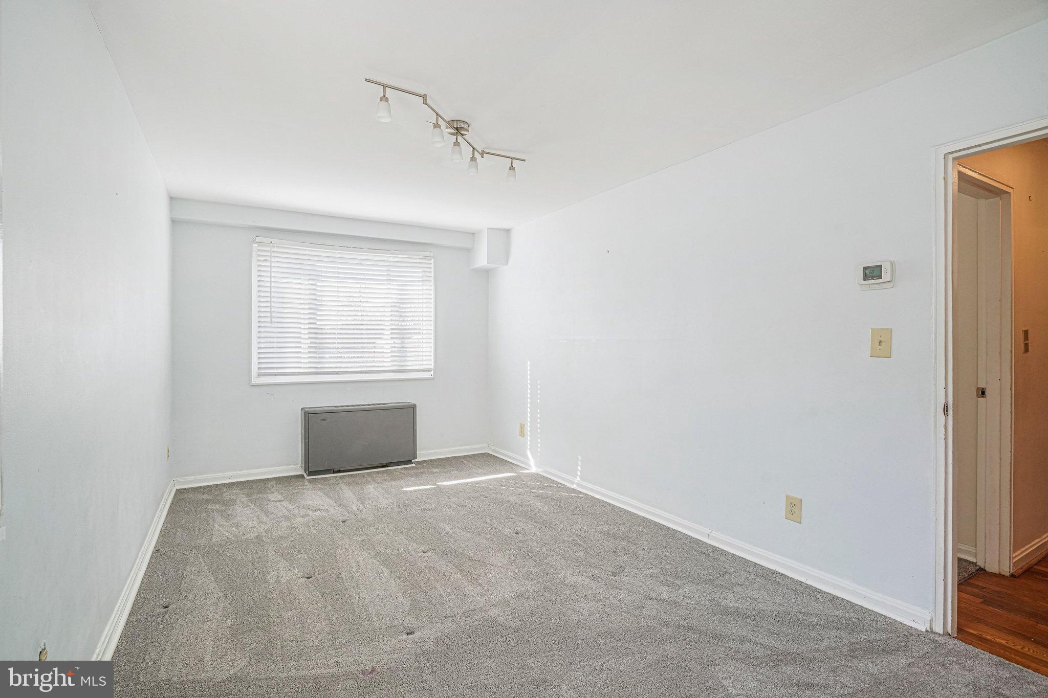 95 East Wayne Avenue, Unit 209 Silver Spring, MD 20901 - Photo 10 of 19 Bright second bedroom with large closets