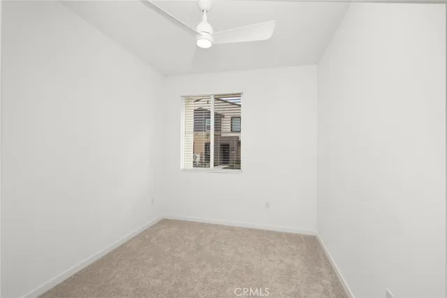 a bathroom with a granite countertop toilet a sink and a bathtub