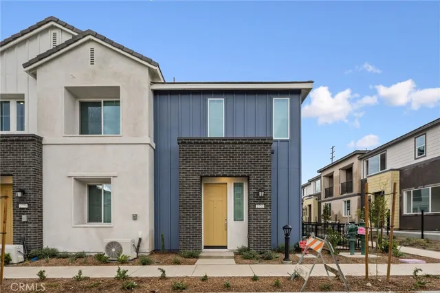 a front view of a house with sitting area