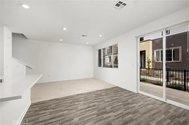a view of a kitchen with a sink and a window