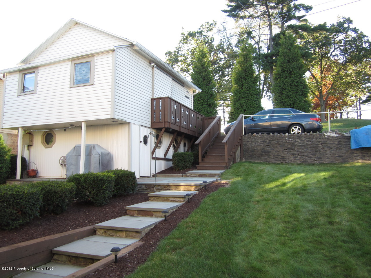362 Point Road Lake Winola, PA 18419 - Photo 15 of 42 a front view of a house with garden