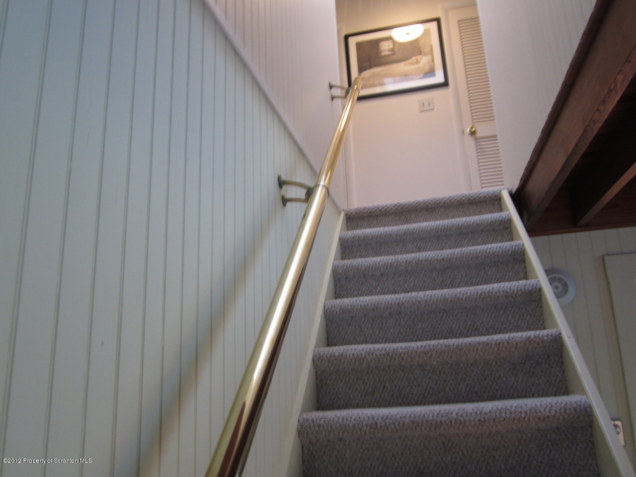 362 Point Road Lake Winola, PA 18419 - Photo 25 of 42 a view of staircase with white walls and a window