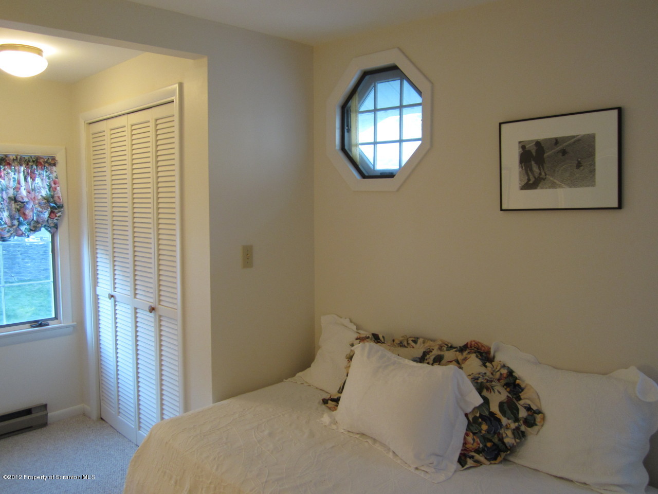362 Point Road Lake Winola, PA 18419 - Photo 30 of 42 a bedroom with a bed and a window