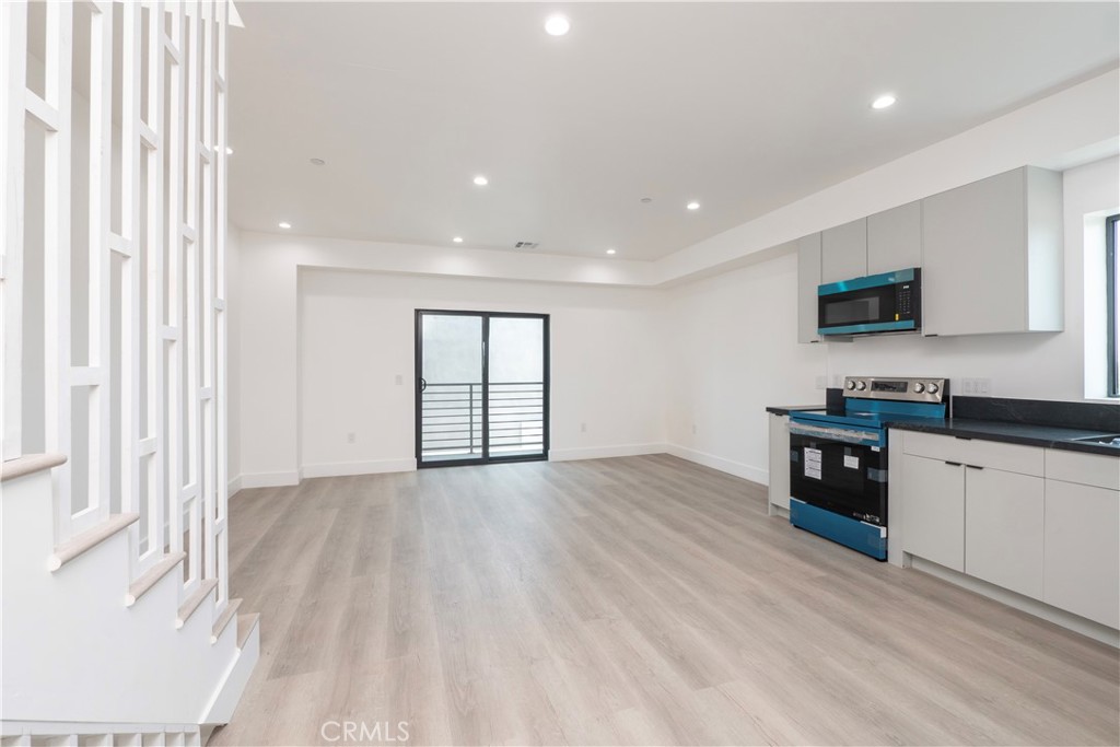 1571 Ricardo Street, Unit 2 Los Angeles, CA 90033 - Photo 3 of 29 a kitchen with granite countertop a stove top oven a sink and a granite counter top
