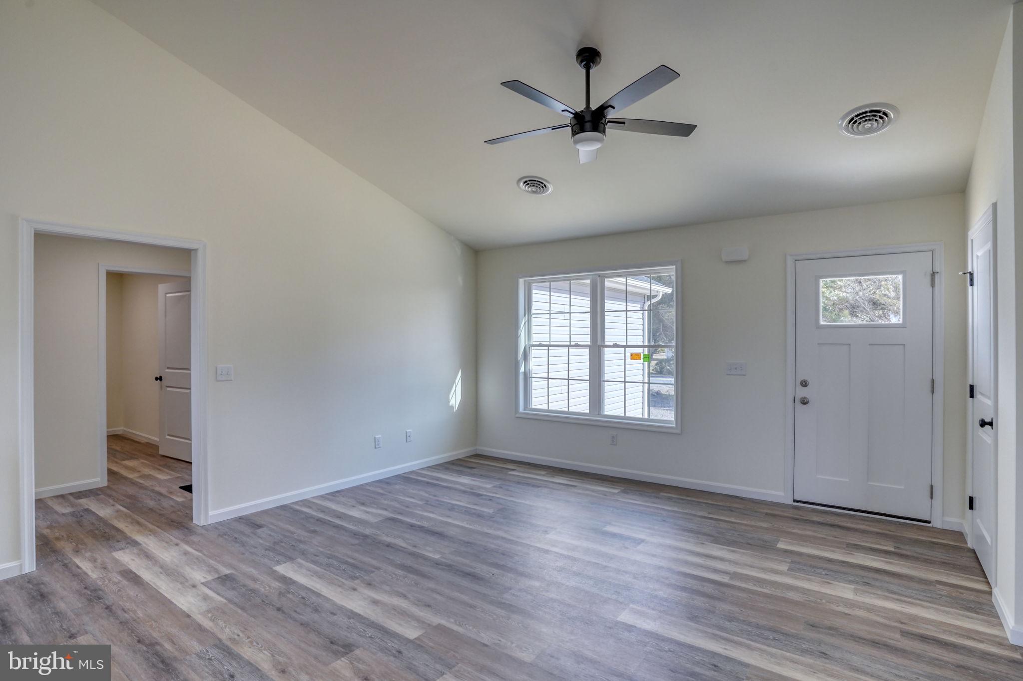 11064 North Union Church Road Lincoln, DE 19960 - Photo 14 of 35 a view of an empty room with wooden floor and a window
