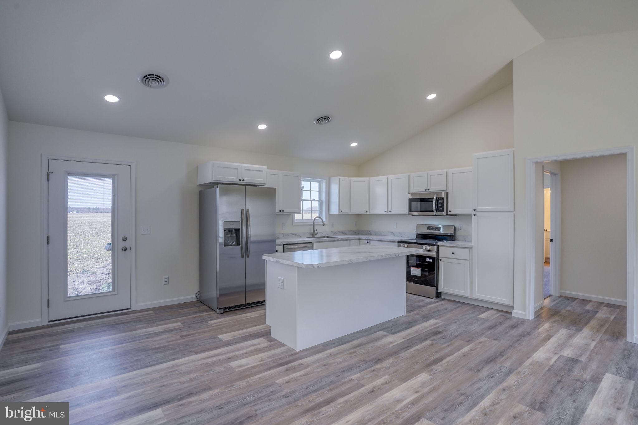 11064 North Union Church Road Lincoln, DE 19960 - Photo 15 of 35 a kitchen with stainless steel appliances granite countertop a refrigerator and a stove top oven