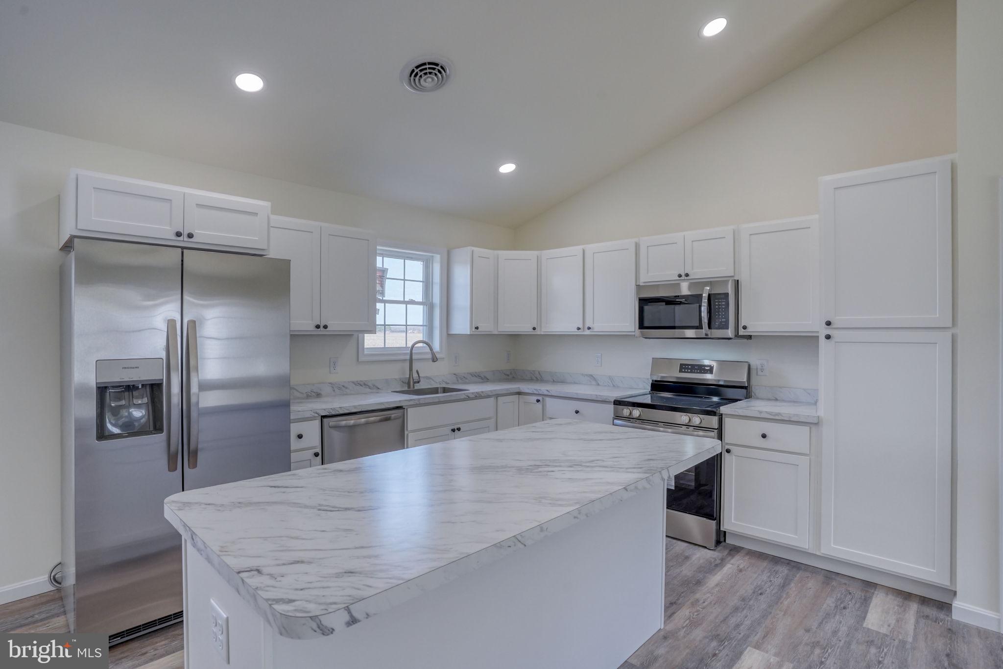 11064 North Union Church Road Lincoln, DE 19960 - Photo 16 of 35 a kitchen with stainless steel appliances granite countertop a sink stove and refrigerator