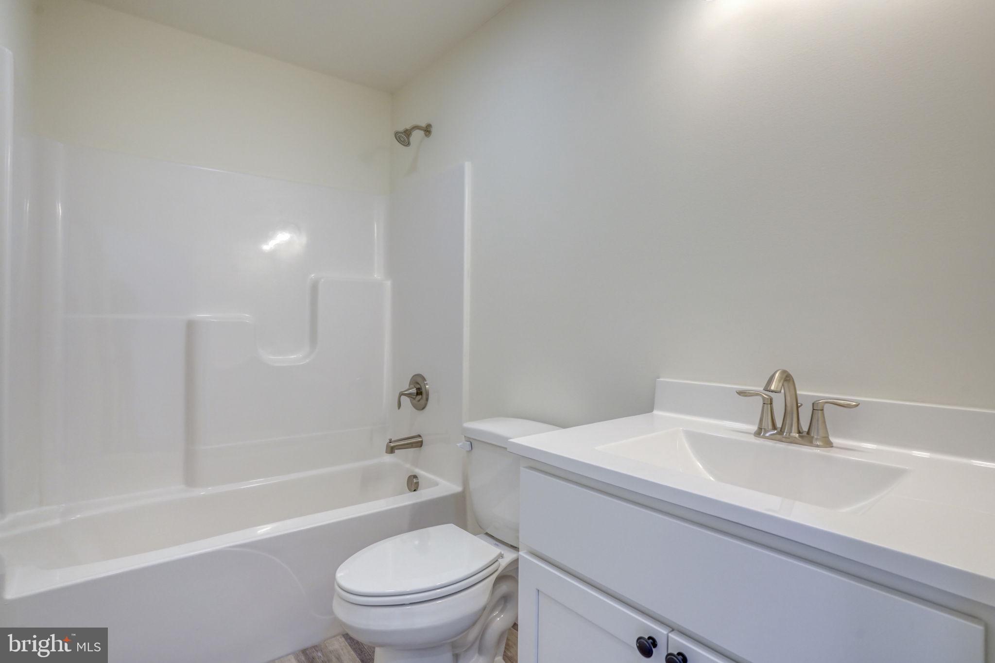 11064 North Union Church Road Lincoln, DE 19960 - Photo 25 of 35 a bathroom with a sink toilet and a bathtub