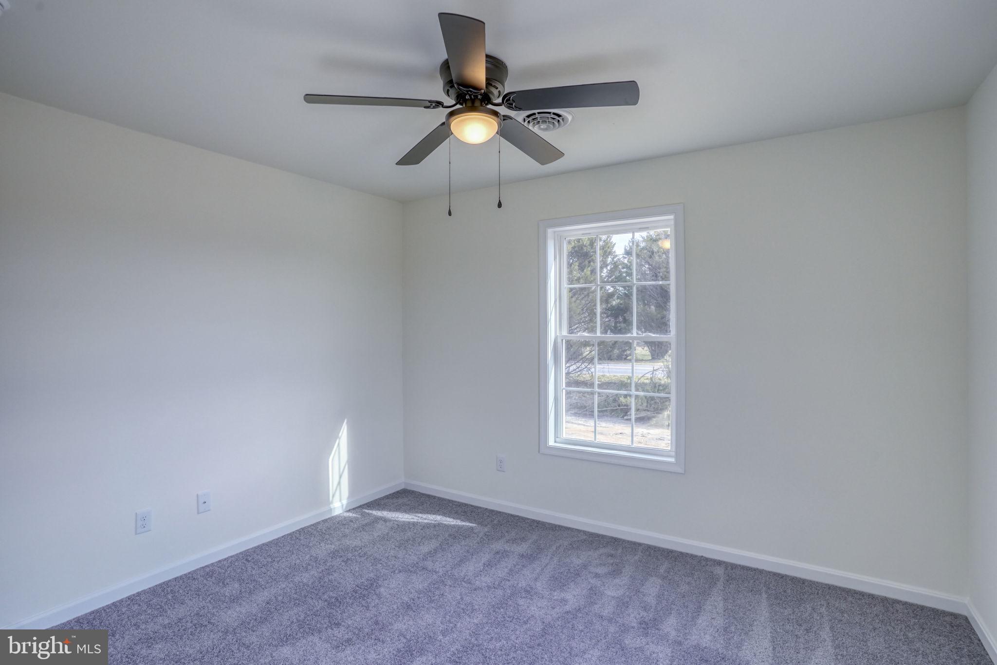 11064 North Union Church Road Lincoln, DE 19960 - Photo 28 of 35 an empty room with window and ceiling fan