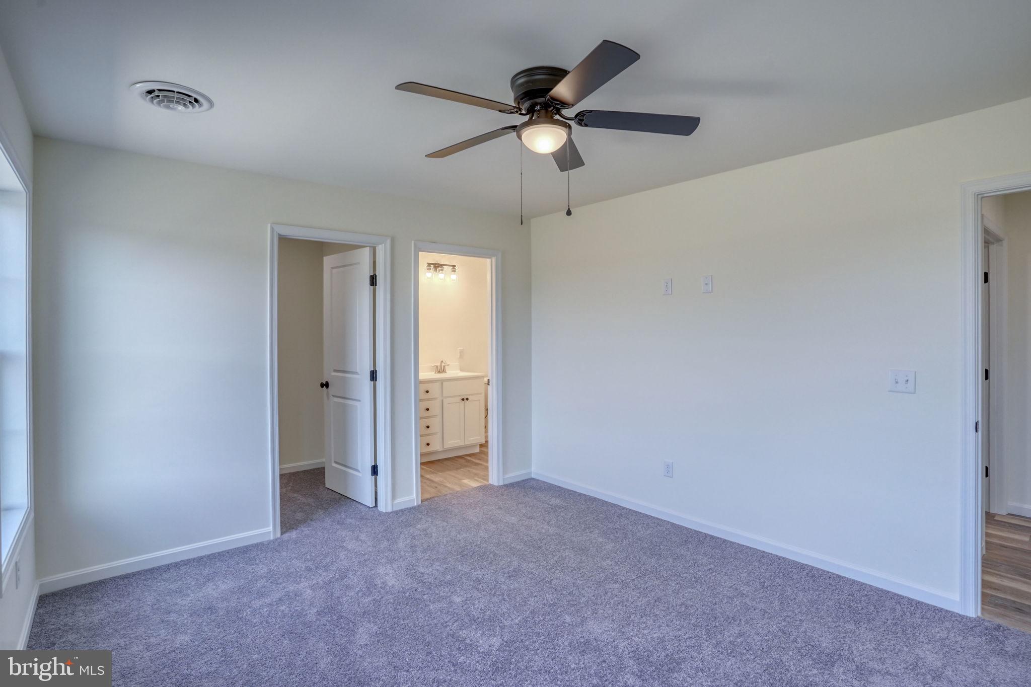 11064 North Union Church Road Lincoln, DE 19960 - Photo 30 of 35 an empty room with closet and a ceiling fan