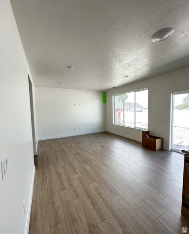 1213 West 500 South Logan, UT 84321 - Photo 29 of 32 Spacious room featuring wood-finish flooring, recessed lighting, and large windows