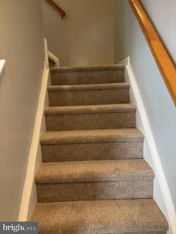 a view of front door with wooden floor