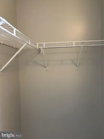 a white toilet sitting next to a shower