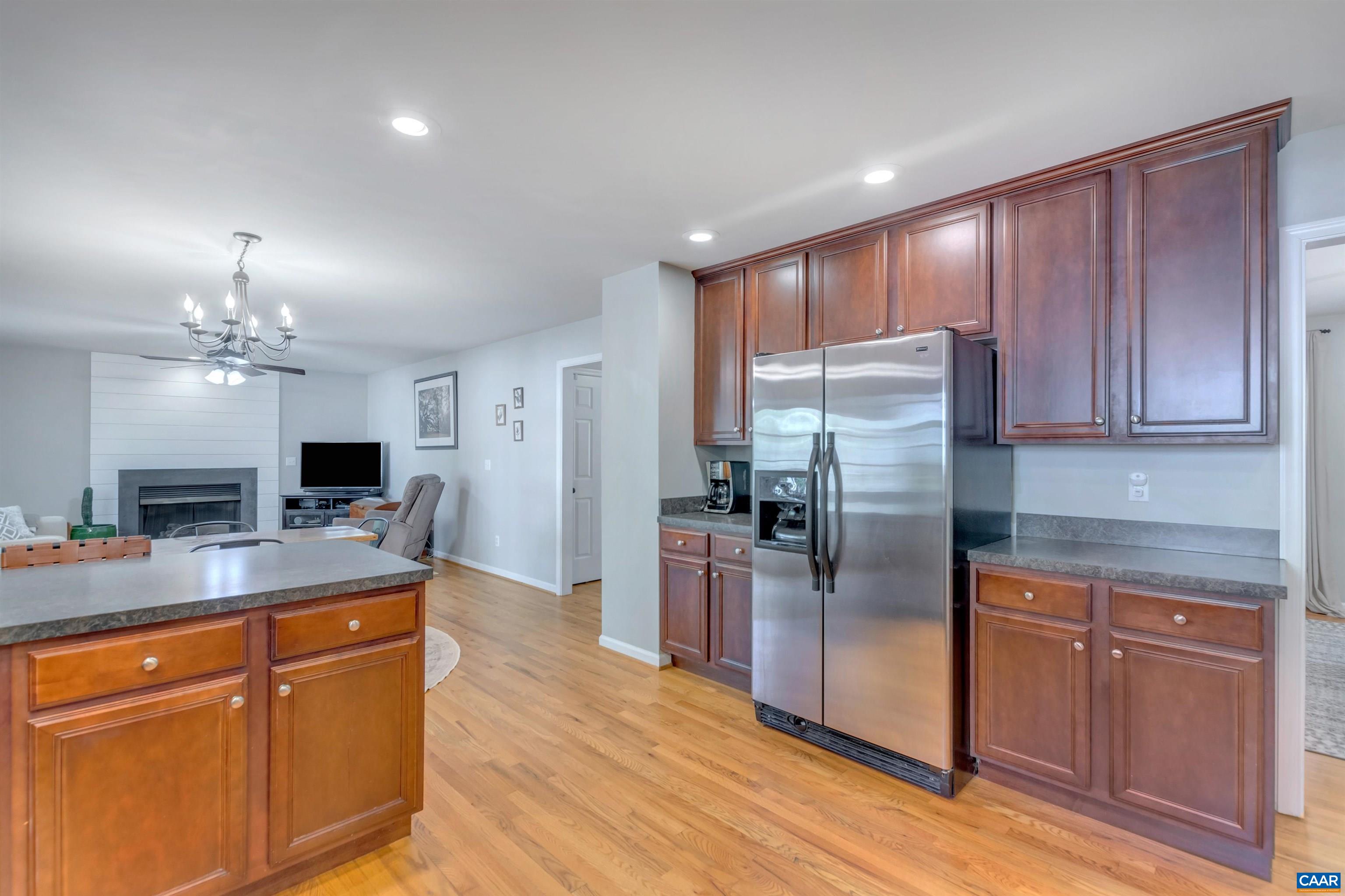 27 East Point Road Palmyra, VA 22963 - Photo 23 of 62 a kitchen with stainless steel appliances granite countertop a refrigerator a sink dishwasher a stove with wooden floor and cabinets