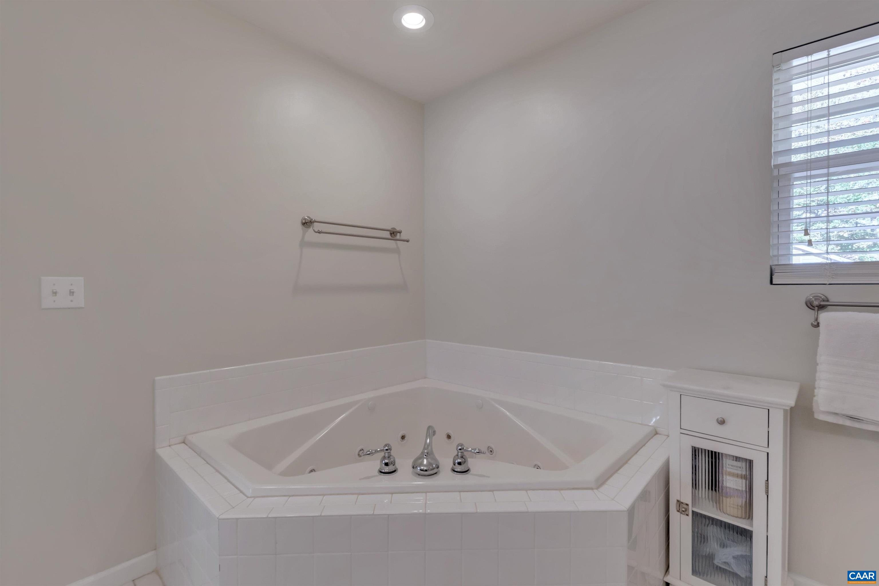 27 East Point Road Palmyra, VA 22963 - Photo 44 of 62 a white bath tub sitting in a bathroom