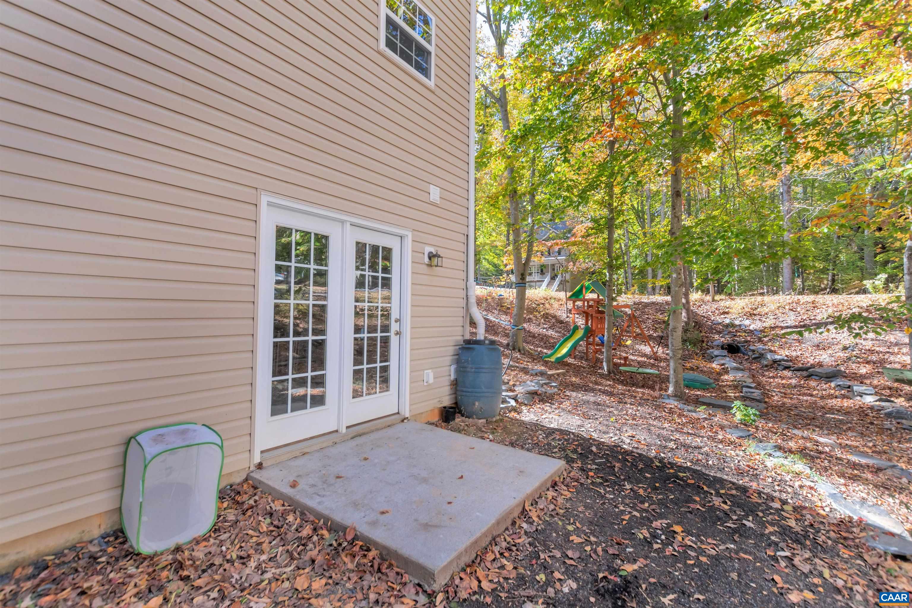 27 East Point Road Palmyra, VA 22963 - Photo 56 of 62 a view of a patio with table and chairs and wooden fence
