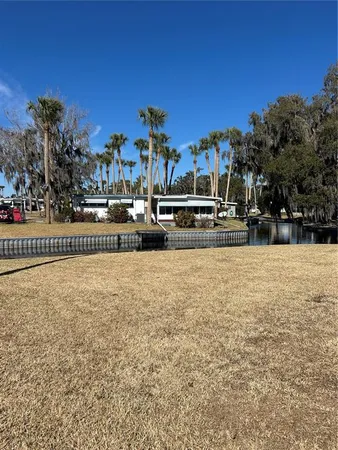 a view of swimming pool with outdoor seating and city view