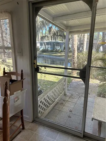 a view of a porch with a floor to ceiling window