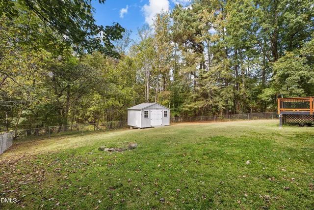 a view of a trees with a yard