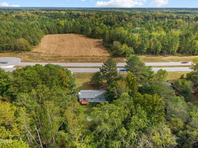 a view of a yard with table and chairs