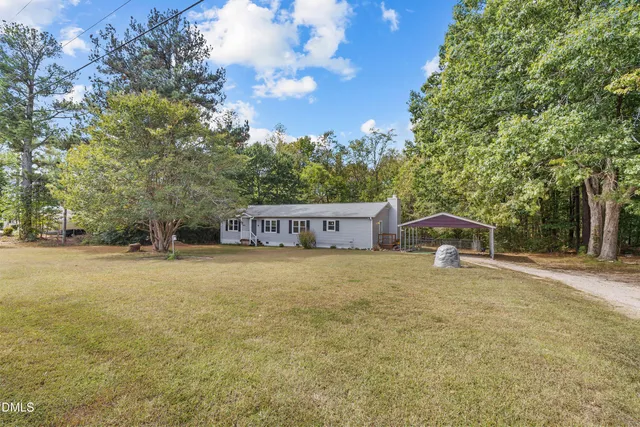 a house with trees in the background