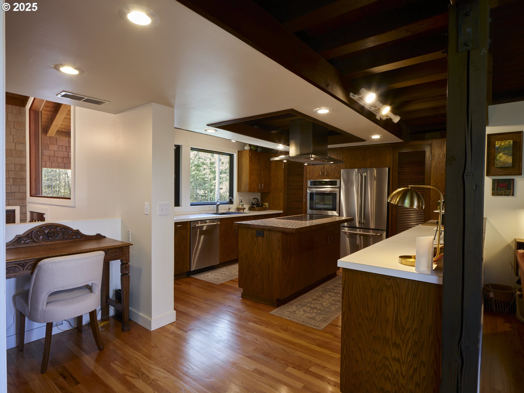 289 Classe Road Toledo, WA 98591 - Photo 12 of 48 a kitchen with sink cabinets and wooden floor