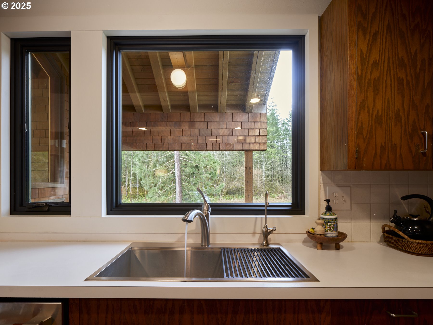289 Classe Road Toledo, WA 98591 - Photo 14 of 48 a kitchen with a sink a window and cabinets