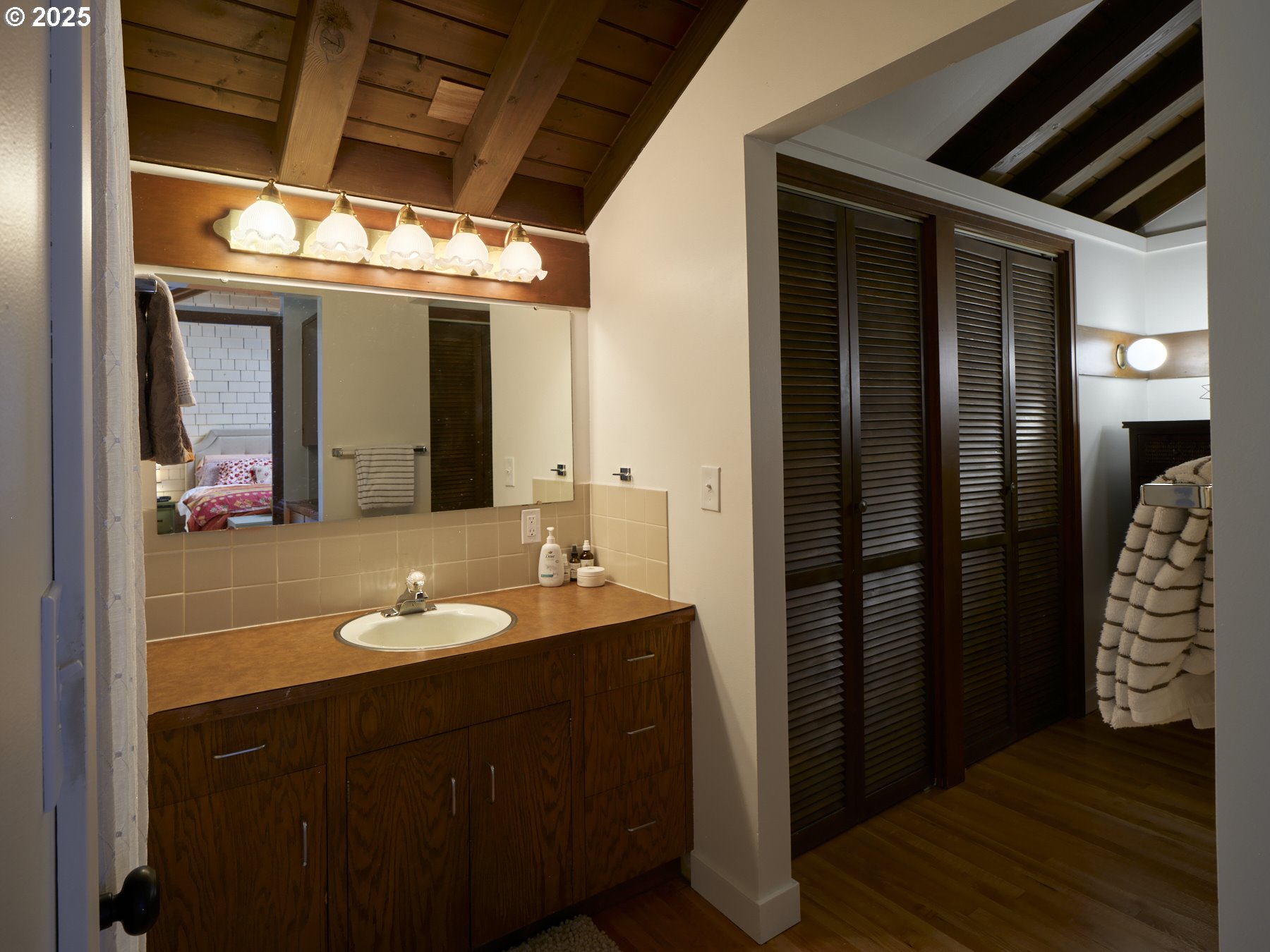 289 Classe Road Toledo, WA 98591 - Photo 28 of 48 a bathroom with a sink mirror and shower