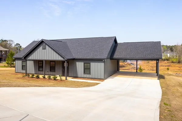 a house with palm trees in front of it