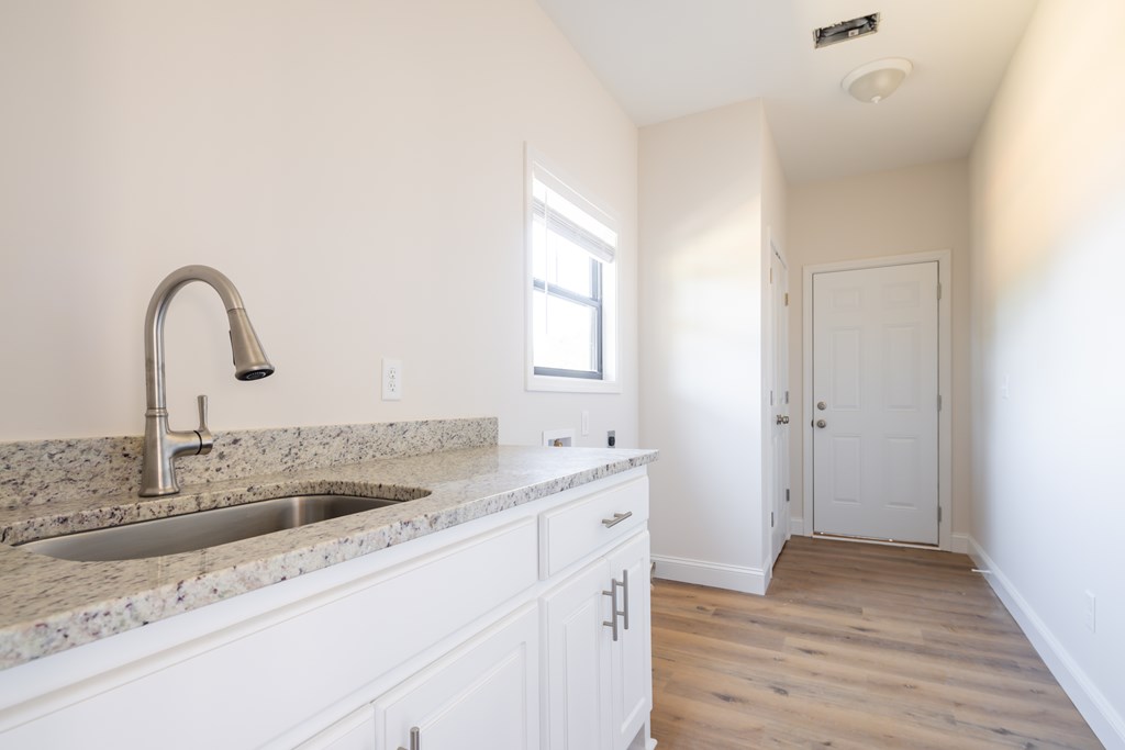 43 Lee Road Salem, AL 36874 - Photo 19 of 19 a kitchen with a sink and a wooden floor