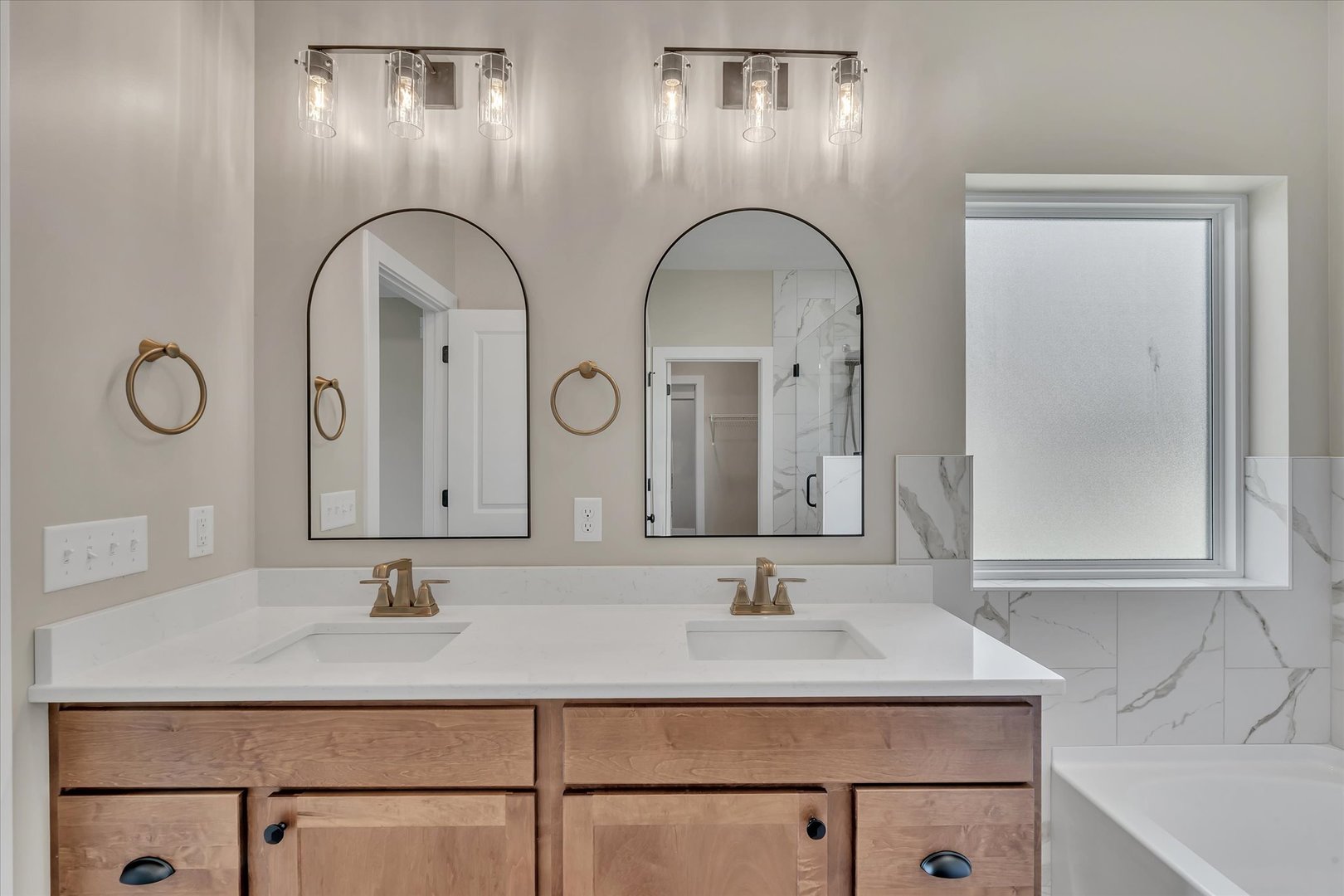 455 Rhonda Road New Liberty, IA 52765 - Photo 35 of 54 a bathroom with double vanity sinks and a vanity