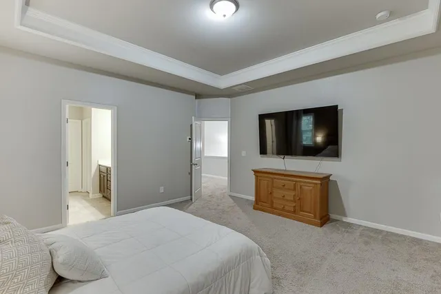 a spacious bathroom with a double vanity sink and a mirror
