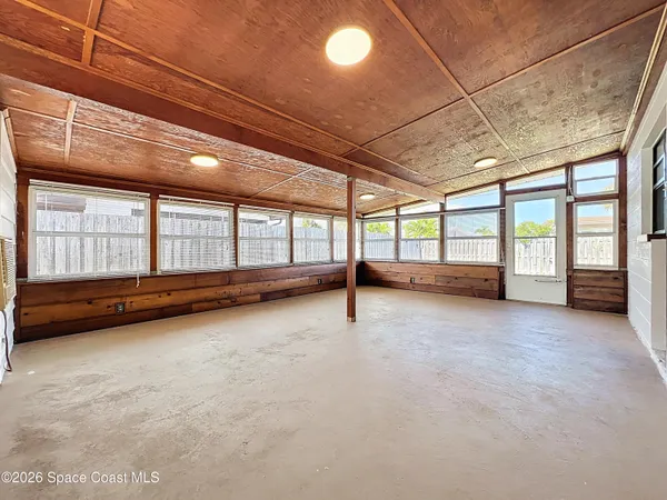a view of an empty room with a window