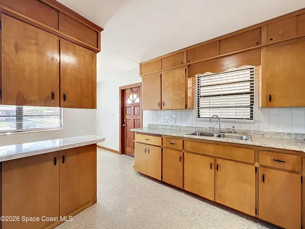 a bathroom with a sink double vanity and a mirror