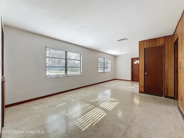 an empty room with windows