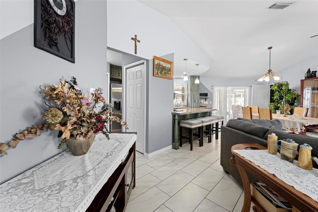4307 Goldcoast Avenue Spring Hill, FL 34609 - Photo 12 of 53 a kitchen with a table and chairs in it