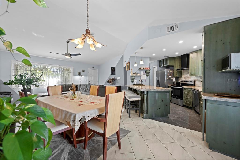 4307 Goldcoast Avenue Spring Hill, FL 34609 - Photo 22 of 53 a kitchen with a table and chairs in it